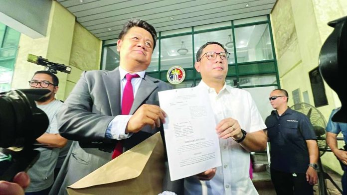 mans_carpio_copy_compressed_resized Atty. Manases “Mans” Carpio (right), husband of Vice President Sara Duterte-Carpio, arrives at the Quezon City Prosecutor’s Office with his lawyer to file charges against top financial regulators and several members of the House Committee on Justice. PHOTO COURTESY OF JASON RUBLICO/SMNI