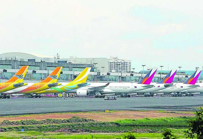 Air travelers can expect a minor drop in plane fares with the fuel surcharge down to Level 18 from Level 19 for the first two weeks of May. This means that on top of the base fare, domestic flyers will pay an additional P593 to P1,734 while international passengers will shell out P1,958.44 to P14,561.87. INQUIRER FILE PHOTO
