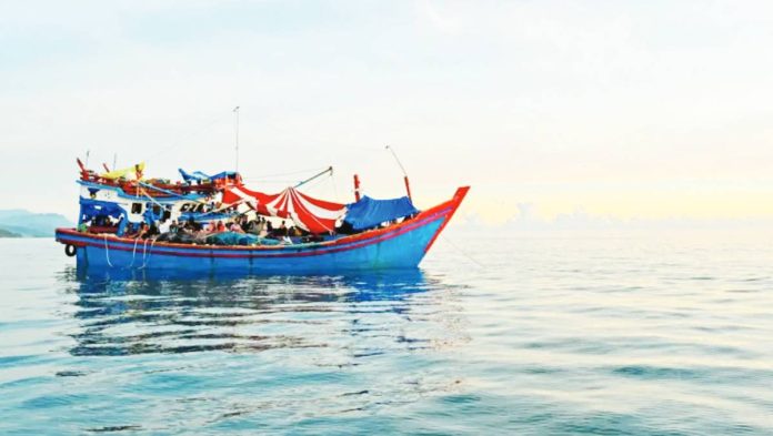 migrant Many Rohingya have been fleeing by sea, as seen in this 2024 file photo of a boat carrying Rohingya refugees in Indonesia. AFP VIA GETTY IMAGES