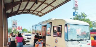 A modern jeepney operated by the Metro Iloilo Transport Services Cooperative (MITSCOOP) loads passengers in front of a mall in Pavia, Iloilo. Amid rising petroleum prices that have forced other transport groups to limit unit deployment, MITSCOOP held an emergency meeting on Tuesday, April 7, 2026, to map out strategies to sustain operations amid high fuel costs. AJ PALCULLO/PN