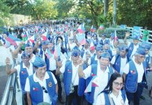 Veterans, reservists, and youth cadets wave Philippine flags as they take part in a Freedom March during the 84th Araw ng Kagitingan commemoration at the University of the Philippines Visayas in Iloilo City, highlighting a renewed push to instill patriotism among younger generations. AJ PALCULLO/PNP
