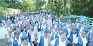 Veterans, reservists, and youth cadets wave Philippine flags as they take part in a Freedom March during the 84th Araw ng Kagitingan commemoration at the University of the Philippines Visayas in Iloilo City, highlighting a renewed push to instill patriotism among younger generations. AJ PALCULLO/PNP