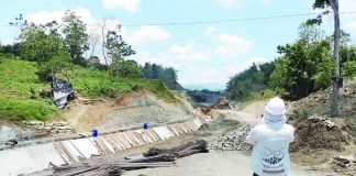 A project engineer inspects ongoing construction of the high line canal of the Jalaur River Multi-Purpose Project Stage II in Calinog, Iloilo. The National Irrigation Administration is fast-tracking construction amid improved weather conditions. NIA-6