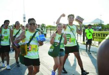 Puregold’s ‘Hakot Relay’ draws 4,000 participants in successful Iloilo leg A lively moment unfolds among friends taking part in the Hakot Relay, with various grocery items in hand.
