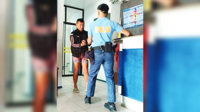 shooting-suspect Lloyd Katipunan (left) is currently in the custody of the Pavia, Iloilo Municipal Police Station, awaiting formal charges of murder and frustrated murder. AJ PALCULLO/PN