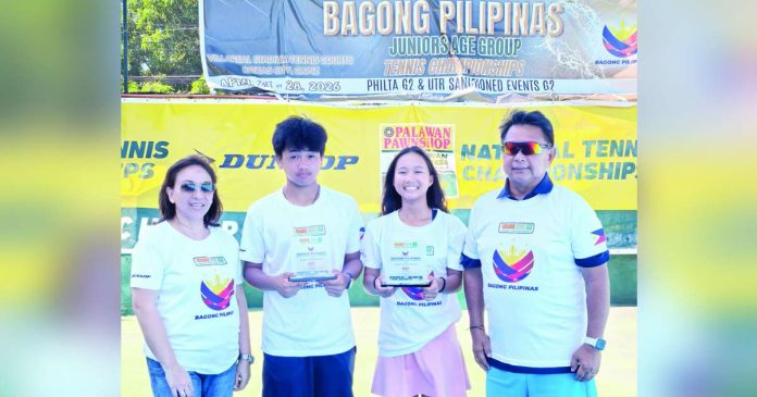 sports Bugna_compressed_superimposed Kathlyn Bugna (third from left) shines anew, capturing three more titles, including two in singles, at the Bagong Pilipinas Junior tennis tournament. Joining her are Tricel Martin, co-MVP Anthony Castigador, and coach Ronald Martin. CONTRIBUTED PHOTO