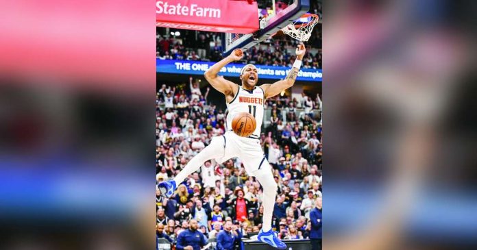 sports Denver_compressed_superimposed Bruce Brown of the Denver Nuggets roars after dunking during the fourth quarter of the Nuggets’ 116-105 win over the Minnesota Timberwolves. PHOTO BY AARON ONTIVEROZ/THE DENVER POST