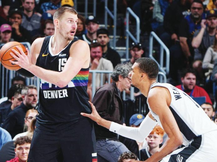 sports Jokic copy Denver Nuggets center Nikola Jokic sizes up San Antonio Spurs' Victor Wembanyama. GETTY IMAGES
