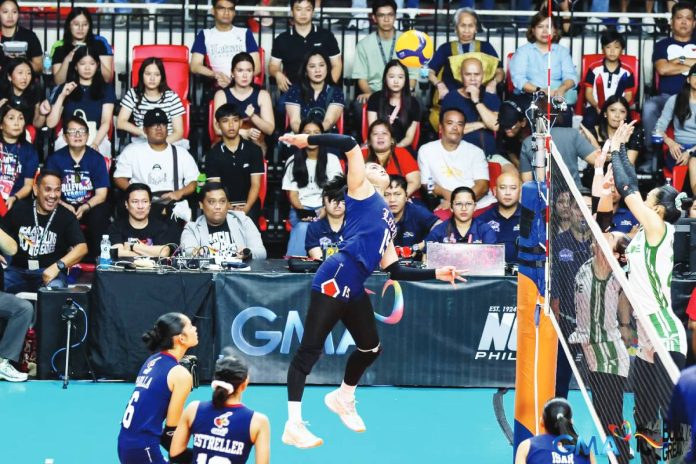 sports Letran National University Lady Bulldogs’ Sam Cantada scores against the defense of University of the East Lady Warriors. UAAP PHOTO