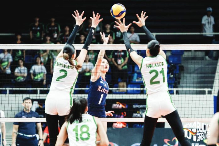 sports Letran copy Judiel Nitura of Colegio de San Juan de Letran Lady Knights attacks against the defense of Camila Amor Bartolome and Zamantha Nolasco of College of Saint Benilde Lady Blazers during Game 1 of the NCAA Season 101 Women’s Volleyball Finals at the Rizal Memorial Coliseum. NCAA PHOTO