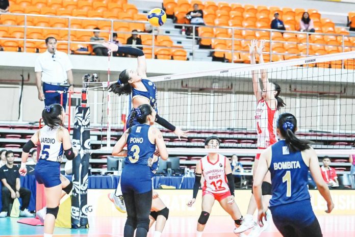 sports NU National University Lady Bulldogs’ Sam Cantada scores against the defense of University of the East Lady Warriors. UAAP PHOTO