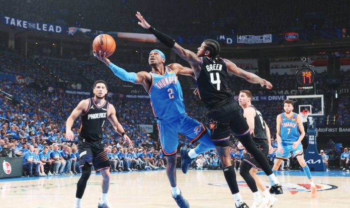 sports OKC copy Oklahoma City Thunder guard Shai Gilgeous-Alexander goes for a tough shot against the defense of Filipino-American guard Jalen Green of Phoenix Suns. GETTY IMAGES