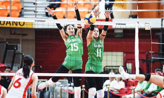 sports UAAP copy Ilongga Amie Provido and Shane Reterta of De La Salle University Lady Spikers block an attack from University of the East Lady Warriors. UAAP PHOTO