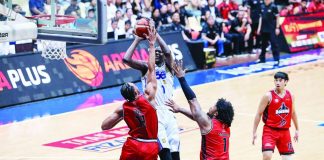 TNT Tropang 5G center Bol Bol attacks the defense of Blackwater Bossing’s James Una for an inside hit.