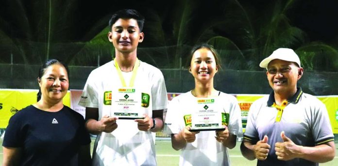 sports_Bugna_copy_compressed_resized Kathlyn Bugna (second from right) and Matthew Morris (second from left) hold their trophies alongside Verde Aces tennis courts owners Jing Alipo-on and Don Alipo-on. CONTRIBUTED PHOTO