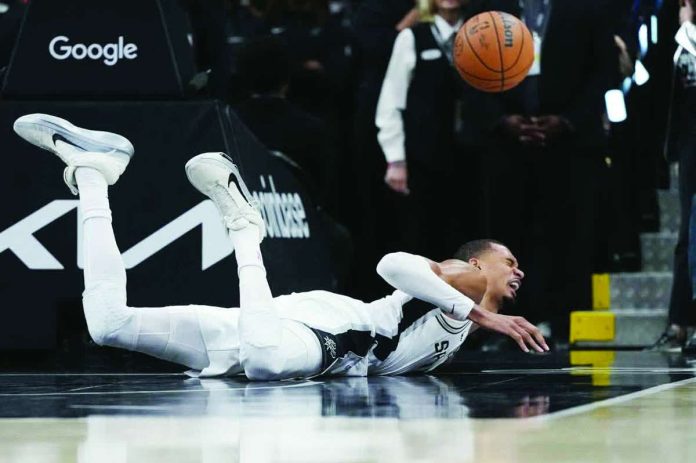 sports_NBA_compressed_resized San Antonio Spurs center Victor Wembanyama was down on the floor after a hard fall. AP PHOTO
