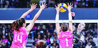 Cignal Super Spikers’ Vanessa Gandler powers through the defense of Creamline Cool Smashers’ Kyle Negrito during their semifinal clash in the PVL All-Filipino Conference at the SM Mall of Asia Arena. UAAP PHOTO