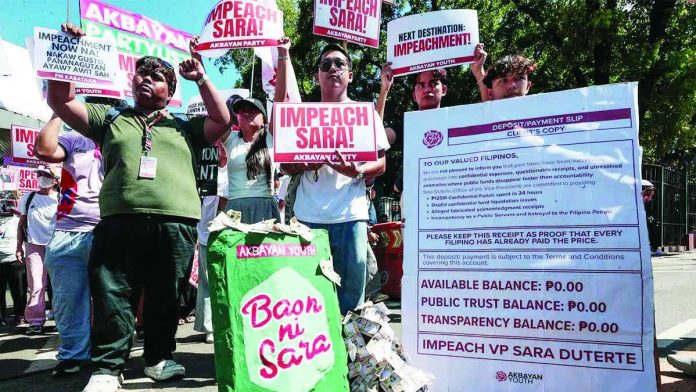 Members of the Akbayan party-list gather outside the House of Representatives on Monday, May 11, 2026, as the chamber began plenary deliberations on the impeachment complaints against Vice President Sara Duterte. Photo by Grig C. Montegrande, Philippine Daily Inquirer