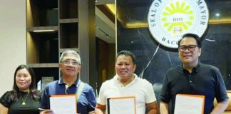 Bacolod City Mayor Greg Gasataya and Schools Division Superintendent Dennis Develos showed the signed memorandum of agreement for the release of P17.3 million in financial assistance for the city’s 2026 Palarong Pambansa contingent at the Mayor’s Office on May 8. BCCO PHOTO