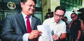 Lawyer Manases “Mans” Carpio (right), husband of Vice President Sara Duterte-Carpio, appears before the Quezon City Prosecutor’s Office on April 27, 2026 with his counsel, Peter Paul Danao, to file a complaint against officials of the Bangko Sentral ng Pilipinas, the Anti-Money Laundering Council, and House lawmakers over disclosures on his finances during hearings related to the impeachment of his wife. PHOTO BY GRIG C. MONTEGRANDE | INQUIRER