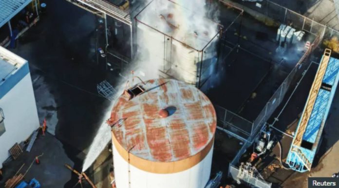 Drone footage shows water being sprayed on a tank as authorities rush to contain a chemical incident in Garden Grove, California, USA. REUTERS