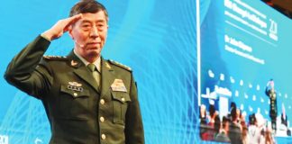 Li Shangfu salutes the audience before delivering a speech during the 20th Shangri-La Dialogue summit in Singapore on June 4, 2023. Li Shangfu served as China defense minister from March to October 2023. AFP VIA GETTY IMAGES