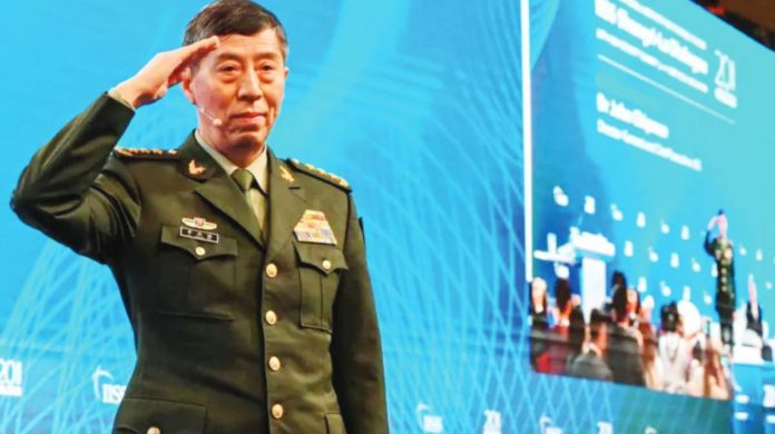 China Li Shangfu salutes the audience before delivering a speech during the 20th Shangri-La Dialogue summit in Singapore on June 4, 2023. Li Shangfu served as China defense minister from March to October 2023. AFP VIA GETTY IMAGES