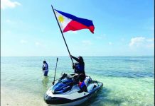 China condemns civilian landing in West PH Sea NO JOKE. Akbayan party-list’s Cong. Dadah Kiram Ismula arrives by jet ski at Pag-asa Cay 2 (Sandy Cay) on Sunday, May 3, 2026, and raises high the Philippine flag. This was the Atin Ito activist coalition’s fourth mission to the West Philippine Sea, challenging China’s trespassing into Philippine waters. PHOTO FROM THE ATIN ITO COALITION