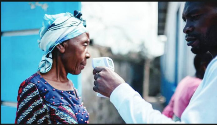 Congo A man holds a contactless infrared thermometer close to a woman's face. The World Health Organization says Ebola virus has spread beyond the Democratic Republic of Congo, with two confirmed cases reported in neighboring Uganda. AFP VIA GETTY IMAGES