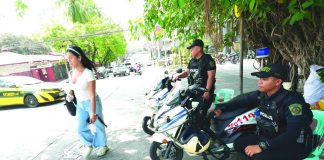 POLICE VISIBILITY. Quezon City Police District officers patrol a major road in Barangay South Triangle, Quezon City. Increased police visibility supports the Department of the Interior and Local Government’s “Safer Cities” program aimed at deterring crime and ensuring public safety. PNA