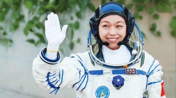 Hong Kong Li Jiaying, Hong Kong’s first astronaut, waves while wearing a full white space. Li Jiaying considers the Shenzhou-23 mission a “rare chance”. REUTERS
