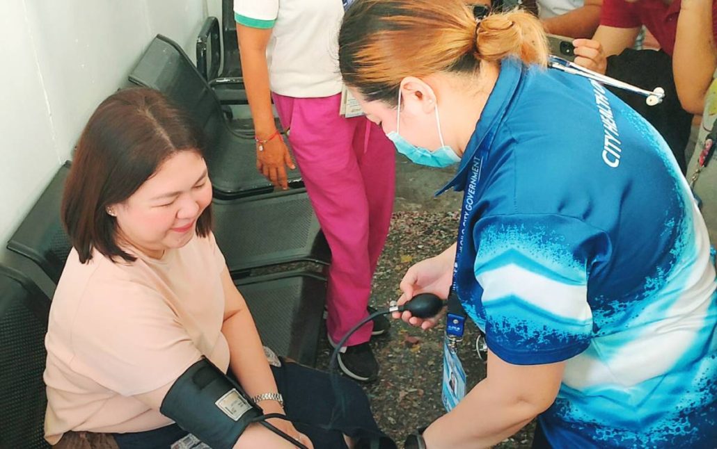 Mayor Raisa Treñas undergoes a blood pressure check inside the newly opened “I-Cool” cooling hub in Mandurriao district, highlighting the city government’s effort to integrate basic health services into its heat mitigation program. AJ PALCULLO/PN