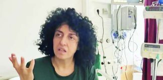 An undated photograph posted by lawyer Chirinne Ardakani showing Iranian Nobel Prize-winning human rights activist Narges Mohammadi gesturing from a hospital bed in Iran. CHIRINNE ARDAKANI