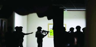 Marine soldiers detailed at the Senate keep their distance from the source of the gunshots that rang out on the second-floor hallway on Wednesday night, May 14, 2026. NIÑO JESUS ORBETA