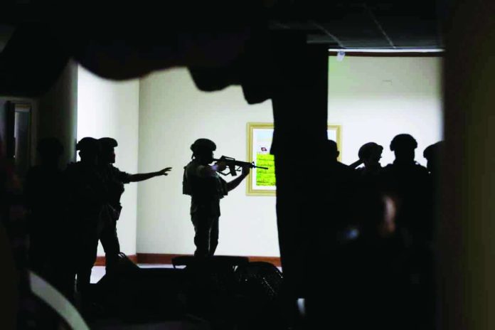 NBI_driver_compressed_resized Marine soldiers detailed at the Senate keep their distance from the source of the gunshots that rang out on the second-floor hallway on Wednesday night, May 14, 2026. NIÑO JESUS ORBETA