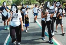 NUJP: Red-tagging, abuse of libel laws still prevalent CONSTITUTIONAL RIGHT. Advocates for press freedom gather at the University of the Philippines in Diliman, Quezon City on May 3, 2026 wearing masks of detained journalist Frenchie Mae Cumpio and slain journalist RJ Ledesma. GRIG C. MONTEGRANDE, PHILIPPINE DAILY INQUIRER