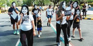 CONSTITUTIONAL RIGHT. Advocates for press freedom gather at the University of the Philippines in Diliman, Quezon City on May 3, 2026 wearing masks of detained journalist Frenchie Mae Cumpio and slain journalist RJ Ledesma. GRIG C. MONTEGRANDE, PHILIPPINE DAILY INQUIRER