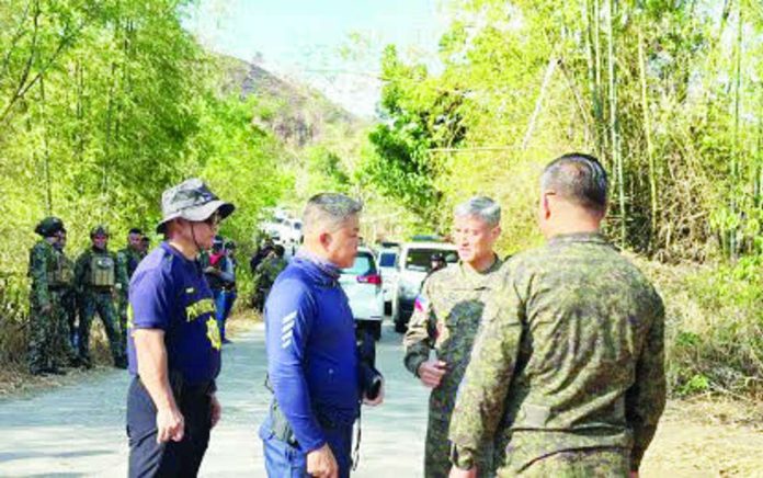 Brig. Gen. Jason Jumawan (second from right), commander of the Philippine Army’s 302nd Infantry Brigade, inspected the area near the encounter site in Barangay Abaca, Cauayan, Negros Occidental on May 17, 2026. Five remnants of the New People’s Army were killed in a clash with troops from the 15th Infantry Battalion on May 16. PHOTO COURTESY OF CHENG SANTILLAN / PNA