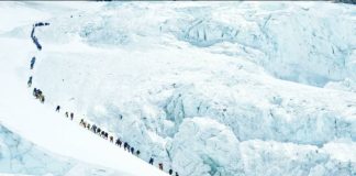 Climbers walk in a long queue as they head to summit Mount Everest in the Solukhumbu district, Nepal. Tourism to the world's tallest mountain has surged despite a mark-up in permit fees. REUTERS