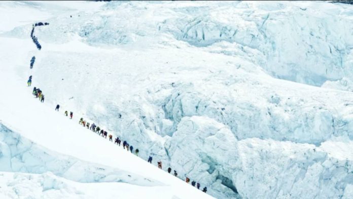 Nepal Climbers walk in a long queue as they head to summit Mount Everest in the Solukhumbu district, Nepal. Tourism to the world's tallest mountain has surged despite a mark-up in permit fees. REUTERS