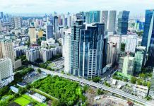 High-rise buildings in the Ortigas Business District in Pasig City looms large in the horizon as seen through a drone shot in this file photo. The Mitsubishi UFJ Financial Group says the rising domestic policy uncertainty could trigger greater capital outflows or weaker inflows, with currency depreciation becoming a growing constraint for policymakers. INQUIRER PHOTO / GRIG C. MONTEGRANDE