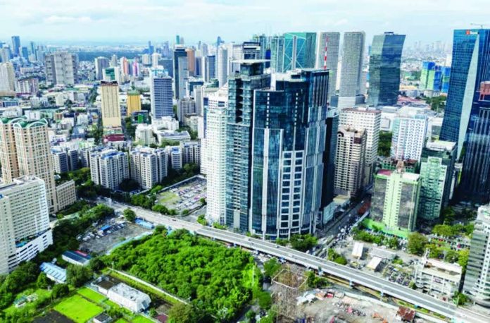 PH_economy_compressed_resized High-rise buildings in the Ortigas Business District in Pasig City looms large in the horizon as seen through a drone shot in this file photo. The Mitsubishi UFJ Financial Group says the rising domestic policy uncertainty could trigger greater capital outflows or weaker inflows, with currency depreciation becoming a growing constraint for policymakers. INQUIRER PHOTO / GRIG C. MONTEGRANDE