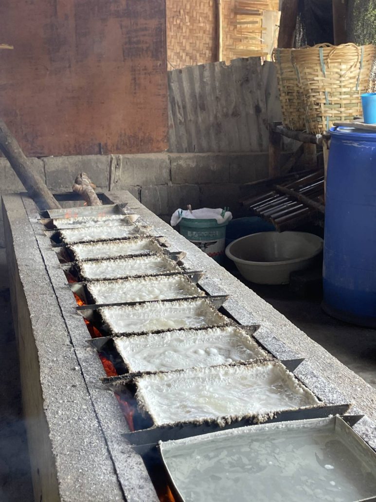 The cooking process of tultul salt over an open fire, which takes eight to 10 hours to complete.