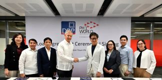 Photo shows DBP President and CEO Michael O. de Jesus (fourth from left) shaking hands with PH1 World Landscapes Chairman Edgar Saavedra (fourth from right) during the loan signing ceremony. Also present in the photo are DBP Senior Vice President Daniel M. Gonzales (third from left) and PH1 World Landscapes President Ma. Gilda G. Alcantara (third from right) along with other DBP and PH1 officials.
