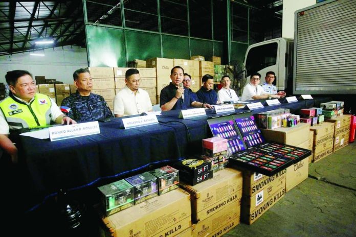 Vape_copy_compressed_resized BIGGEST VAPE HAUL. Bureau of Customs Commissioner Ariel Nepomuceno (with mic) leads a press conference announcing the seizure of P1.4 billion worth of illegal vape products at a warehouse in Navotas City on March 23, 2026. Nepomuceno said it is the Customs’ largest vape seizure to date. PNA