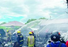 Firefighters and volunteers work together to extinguish a fire that broke out in Barangay Mohon, Arevalo, Iloilo City, on Thursday afternoon, May 7, 2026. The incident left two houses totally destroyed and one partially damaged. PHOTO BY FRENCH ROVIE ANTIZA/UA INTERN, AJ PALCULLO/PN