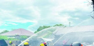 Firefighters and volunteers work together to extinguish a fire that broke out in Barangay Mohon, Arevalo, Iloilo City, on Thursday afternoon, May 7, 2026. The incident left two houses totally destroyed and one partially damaged. PHOTO BY FRENCH ROVIE ANTIZA/UA INTERN, AJ PALCULLO/PN