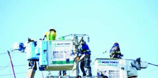 MORE Electric and Power Corporation linemen are doing maintenance work in Iloilo City in this file photo. The Department of Energy said Wednesday, May 6, that government measures helped prevent a possible P7 per kilowatt-hour increase in electricity rates amid the Middle East crisis. MORE POWER PHOTO