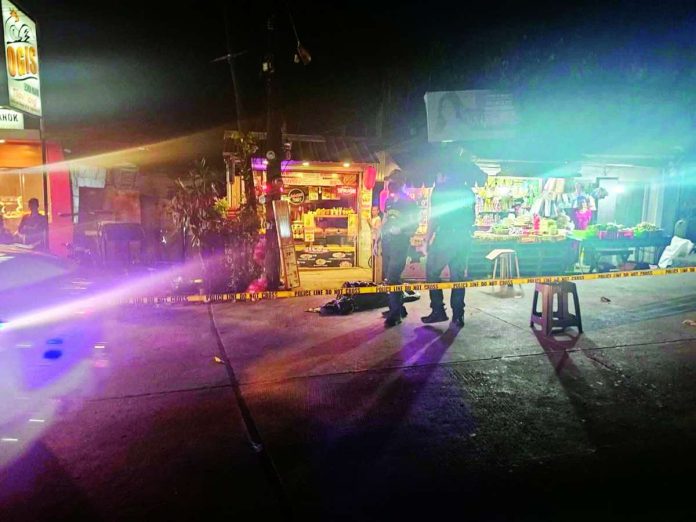 bacolod_shooting_compressed_resized Police officers gather at a cordoned-off section of Purok Mahimulaton, Barangay Banago, Bacolod City, where 39-year-old Victor Hermano was gunned down on Wednesday, May 27, 2026. The victim sustained fatal gunshot wounds and was declared dead at the scene. BCPO PHOTO