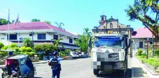 Police Regional Office-6 director Brigadier General Josefino Ligan (left photo) says police personnel found protecting, facilitating, or directly participating in illegal quarry activities would face both criminal and administrative sanctions. Right photo shows an officer from the Sta. Barbara Municipal Police Station flagging down a dump truck at the town plaza during a province-wide crackdown on illegal quarrying. PRO-6 / IPPO PHOTOS